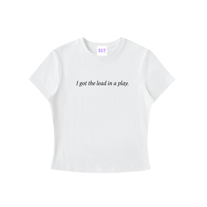 White t-shirt with text 'I got the lead in a play.' on a white background