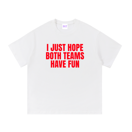 White t-shirt with red text 'I JUST HOPE BOTH TEAMS HAVE FUN' on a white background