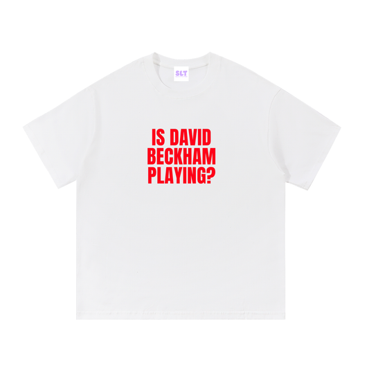 White t-shirt with red text 'IS DAVID BECKHAM PLAYING?' on a white background