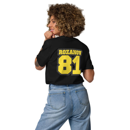 Person wearing a black t-shirt with 'ROZANOV 81' printed on the back, standing against a white background.