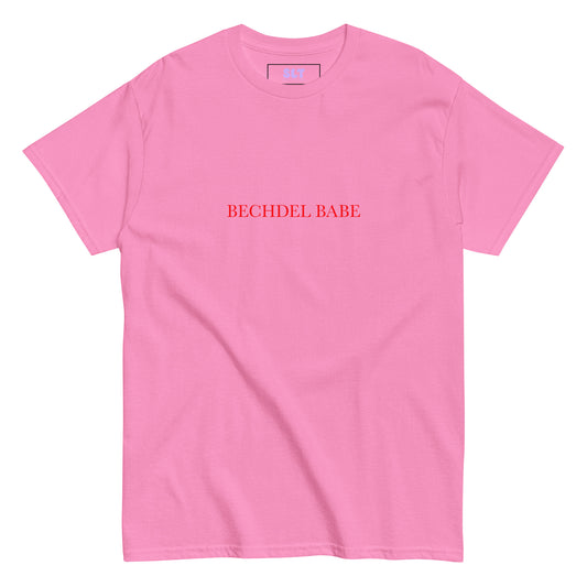 White t-shirt with “Bechdel Babe” slogan in bold red type, styled with jeans and feminist books.