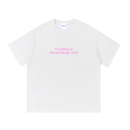 White t-shirt with a pink graphic and text on a white background
